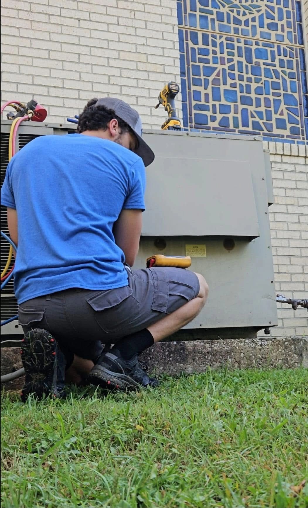 Technician working on commercial HVAC system