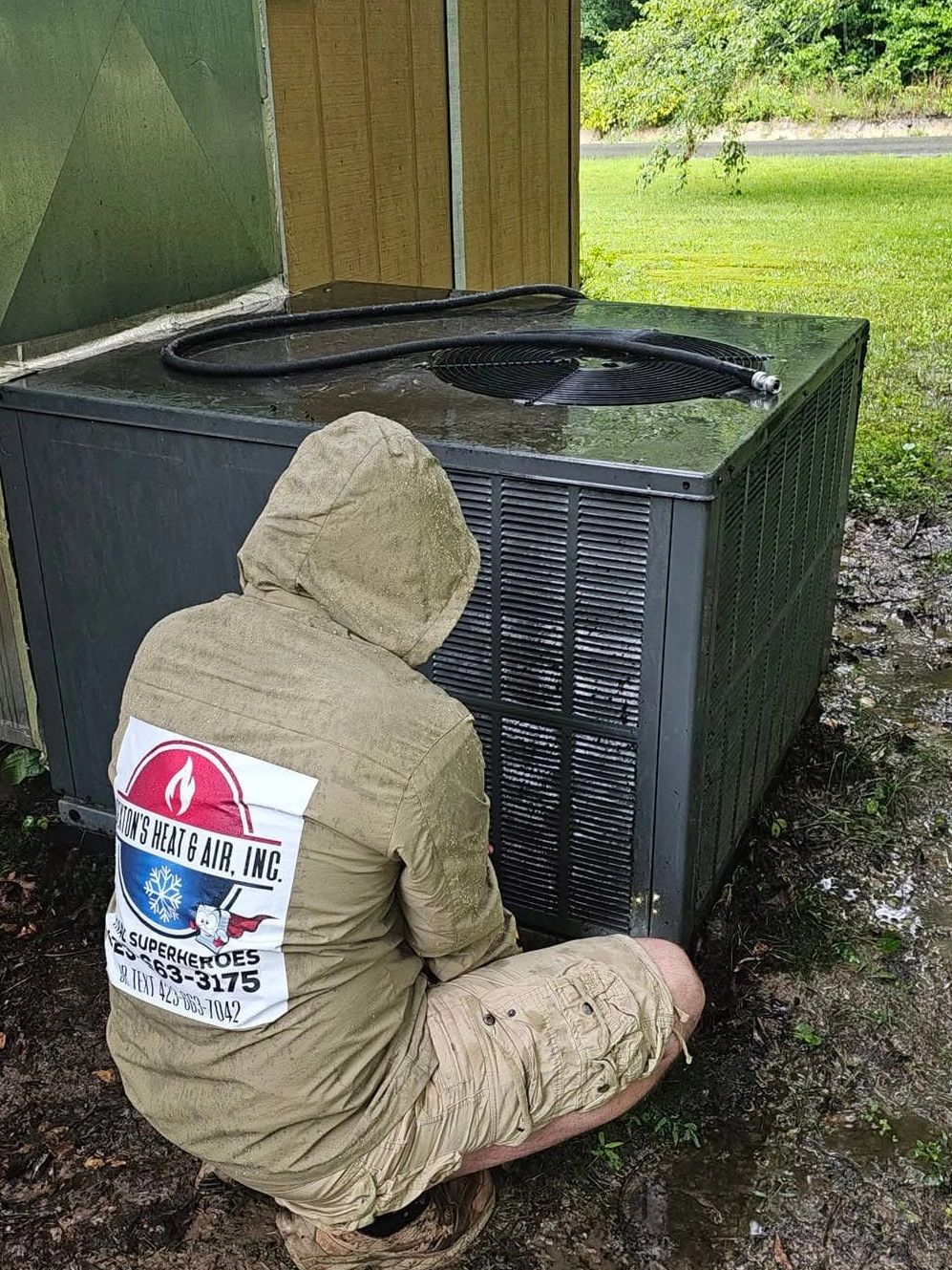 HVAC technician servicing residential unit